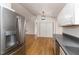 Kitchen featuring stainless steel fridge and dishwasher, and entrance to living room at 3413 Thistledown Ct, Efland, NC 27243