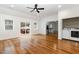 Hardwood-floored living room with sliding glass doors to the outdoor deck, and laundry unit at 3413 Thistledown Ct, Efland, NC 27243