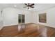 Bright and airy living room with hardwood floors, large windows, and sliding glass door to deck at 3413 Thistledown Ct, Efland, NC 27243