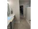 Elegant bathroom with double vanity and large walk-in closet at 3601 River Watch Ln, Franklinton, NC 27525