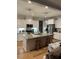 Modern kitchen with island and stainless steel appliances at 3601 River Watch Ln, Franklinton, NC 27525