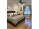 Comfortable main bedroom with hardwood floors at 3601 River Watch Ln, Franklinton, NC 27525