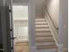 Modern staircase with storage and hardwood floors at 3601 River Watch Ln, Franklinton, NC 27525