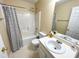 Bright bathroom with a single sink vanity, shower-tub combination and neutral wall color at 4809 Kaycee Ct, Raleigh, NC 27616