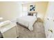 Cozy bedroom with soft carpet, queen bed, and natural light from the bright window at 4809 Kaycee Ct, Raleigh, NC 27616