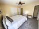 A bedroom featuring a bed with gray pillows and neutral colored walls at 4809 Kaycee Ct, Raleigh, NC 27616