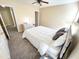 A bedroom with a ceiling fan, neutral color, and carpeted floor at 4809 Kaycee Ct, Raleigh, NC 27616