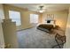 Neutral bedroom featuring soft carpet, neutral walls, natural light, and a relaxing queen bed at 4809 Kaycee Ct, Raleigh, NC 27616