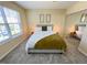 Relaxing bedroom featuring soft carpet, natural light, large closet and a comfortable queen bed at 4809 Kaycee Ct, Raleigh, NC 27616