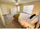 Bedroom featuring soft carpet, neutral walls, natural light, ceiling fan and a relaxing queen bed at 4809 Kaycee Ct, Raleigh, NC 27616