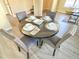 Dining room showcasing a set table with seating for four, perfect for intimate gatherings at 4809 Kaycee Ct, Raleigh, NC 27616