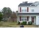 Charming two-story home with a landscaped yard and a cozy front porch entrance at 4809 Kaycee Ct, Raleigh, NC 27616