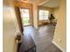 Welcoming foyer featuring a coat rack, a view into the living area, and an abundance of natural light at 4809 Kaycee Ct, Raleigh, NC 27616