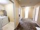 Second floor hallway with carpet, doorways to laundry, bathroom, and bedrooms, plus air vent at 4809 Kaycee Ct, Raleigh, NC 27616