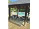 Community swimming pool featuring picnic tables, and lush surroundings on a sunny day at 4809 Kaycee Ct, Raleigh, NC 27616