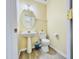 Small powder room with a pedestal sink, wood-look flooring and towel rack at 4809 Kaycee Ct, Raleigh, NC 27616