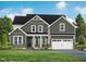 Two-story house with green siding, white trim, and a two-car garage at 4816 Bristol Meadow Dr, Raleigh, NC 27603