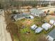 Backyard view of house with shed, covered items, and some debris at 517 Kildaire Farm Rd, Cary, NC 27511