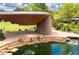 Amphitheater and pond with families enjoying the area at 517 Kildaire Farm Rd, Cary, NC 27511