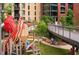 Modern playground with unique structures and walking bridge at 517 Kildaire Farm Rd, Cary, NC 27511