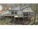 Aerial view of the home's rear exterior with a new deck and screened porch at 5709 Russell Rd, Durham, NC 27712
