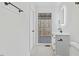 A well-lit bathroom features a white vanity, modern fixtures, and tile flooring at 5709 Russell Rd, Durham, NC 27712