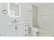 A bathroom with a toilet and shower with new tiling at 5709 Russell Rd, Durham, NC 27712