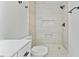 Updated bathroom features modern shower and white vanity at 5709 Russell Rd, Durham, NC 27712