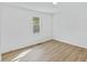 Bedroom features a window to provide natural light and wood-look floors at 5709 Russell Rd, Durham, NC 27712