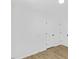 A bedroom with two doors and wood-look floors provides a blank canvas to make it your own at 5709 Russell Rd, Durham, NC 27712