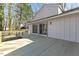 New wooden deck with metal cable railing and sliding glass doors to the home's interior at 5709 Russell Rd, Durham, NC 27712