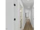 Bright hallway with modern fixtures and new wood flooring at 5709 Russell Rd, Durham, NC 27712