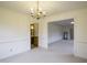 Dining room with chandelier and view into living room and bathroom at 610 Denim Dr, Erwin, NC 28339