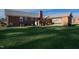 Brick home with covered patio, large backyard, and mature lawn at 610 Denim Dr, Erwin, NC 28339