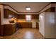 Kitchen with wood cabinets and white appliances at 610 Denim Dr, Erwin, NC 28339
