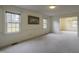 Spacious living room with carpeting, neutral walls, and natural light at 610 Denim Dr, Erwin, NC 28339