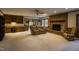 Living room with brick fireplace, built-in shelving, and comfortable seating at 610 Denim Dr, Erwin, NC 28339