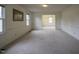 Open living room with view into dining room and neutral decor at 610 Denim Dr, Erwin, NC 28339
