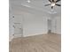 Bright room with wood flooring, fan, recessed lights and a door to the bathroom at 6294 River Rd, Fuquay Varina, NC 27526