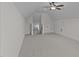 Large bonus room featuring plush carpeting and access to attic storage at 6294 River Rd, Fuquay Varina, NC 27526