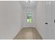 Bright entryway with light wood flooring and a view of the outdoors through the front door at 6294 River Rd, Fuquay Varina, NC 27526