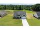 Inviting craftsman home featuring a well-manicured lawn and a light gray color palette at 6294 River Rd, Fuquay Varina, NC 27526