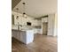 New kitchen featuring white cabinets, granite countertops, and stainless steel appliances in a modern design at 6294 River Rd, Fuquay Varina, NC 27526