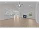 Open-concept living room and kitchen area with modern finishes and plenty of natural light at 6294 River Rd, Fuquay Varina, NC 27526