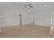 Bright and airy living space featuring a high ceiling, modern flooring, and ample space for relaxation at 6294 River Rd, Fuquay Varina, NC 27526