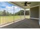 Relaxing screened porch with views of the green lawn and surrounding trees at 6294 River Rd, Fuquay Varina, NC 27526