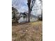 Tan house with white porch and railing, large tree in front yard at 715 Star St, Rocky Mount, NC 27804
