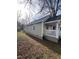 Side view of tan house with white porch and railing at 715 Star St, Rocky Mount, NC 27804