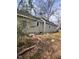 Side view of tan house with large tree and yard at 715 Star St, Rocky Mount, NC 27804