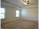 Bright bedroom featuring neutral walls and carpet, plus a ceiling fan at 897 Golden Plum Ln, Zebulon, NC 27597